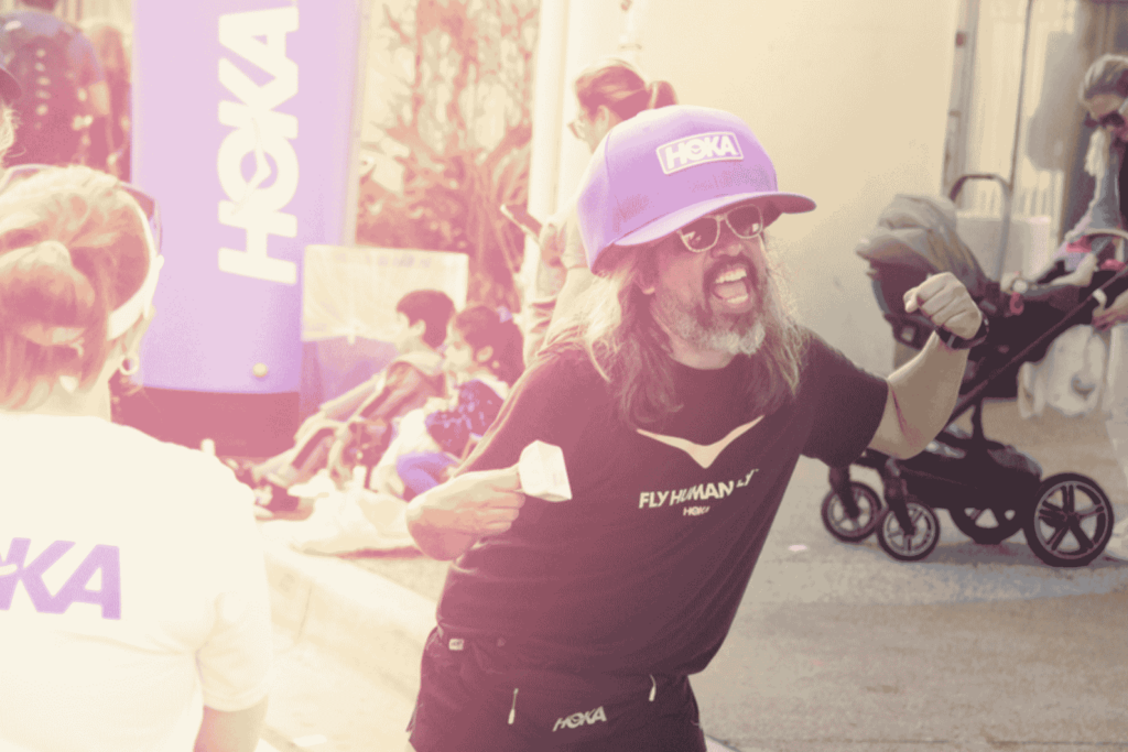 A photograph of a man cheering